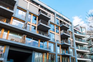modern apartments with balconys and blue sky